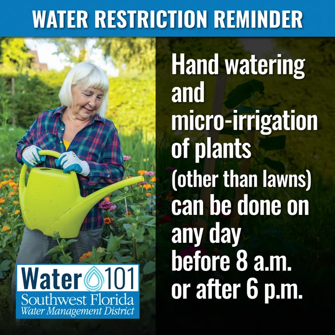An informational graphic titled "Water Restriction Reminder" from the Southwest Florida Water Management District. On the left, a smiling older woman in a plaid shirt stands in a lush flower garden holding a large, bright green watering can. On the right, large white text reads: "Hand watering and micro-irrigation of plants (other than lawns) can be done on any day before 8 a.m. or after 6 p.m." The "Water 101" logo for the district is in the bottom left corner.