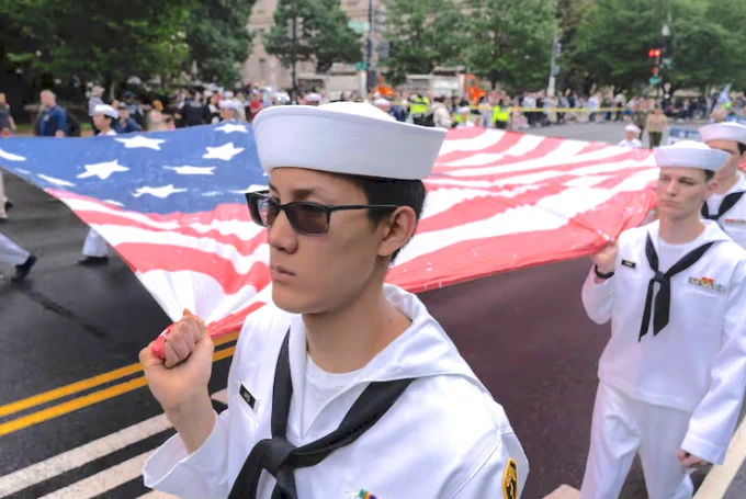 Image: Participants holding an American flag during a parade in Washington to commemorate Memorial Day, Monday, May 25, 2026, coinciding with the nation's 250th anniversary celebrations. Photo by Jose Luis Magaña, Associated Press.