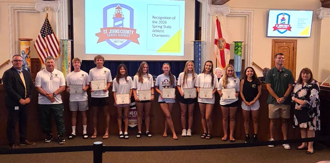 Group photo of award recipients and officials at St. Johns County School District honoring 2026 Spring State Athletic Champions.