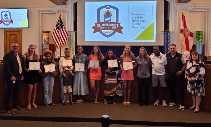 Group photo of award recipients and officials at St. Johns County School District honoring 2026 Spring State Athletic Champions.