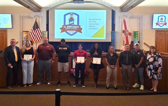 Group photo of award recipients and officials at St. Johns County School District honoring 2026 Spring State Athletic Champions.