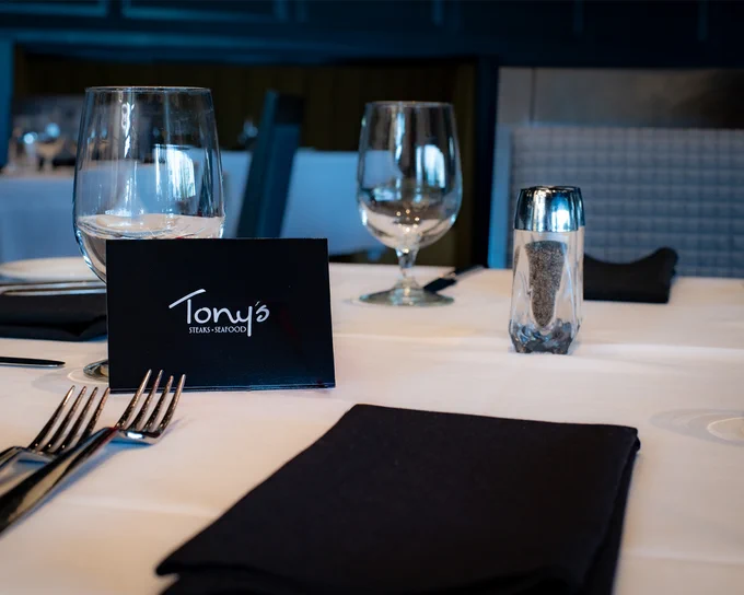 Elegantly set table with Tony's gift card displayed