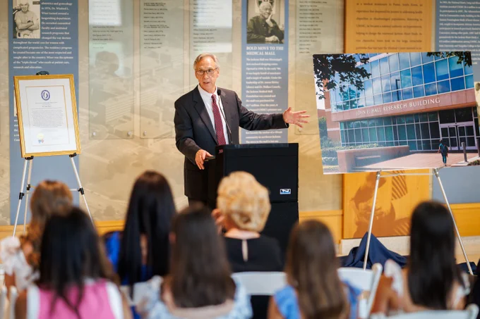 Dr. John E. Hall, retiring Arthur C. Guyton Professor and longtime chair of the Department of Physiology and Biophysics, expresses surprise and heartfelt gratitude for the recognition and tribute during his recent retirement ceremony.
