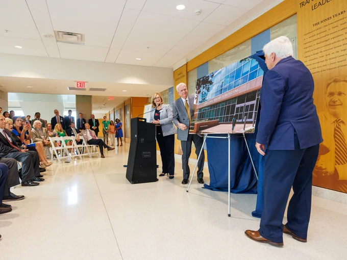 Woodward, Dr. Dan Jones and Granger unveil the John E. Hall Research Building.