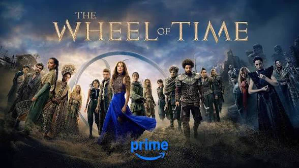 A promotional poster for The Wheel of Time S3 with characters grouped in front of various backgrounds side by side to create a large curved image.  From left to right we see Min, Mat, Nynaeve, Siuan and Elayne in front of a Tanchico shack; next is Egwene, Rand, Moiraine, Lan and Aviendha in front of the Rhuidean Three Rings; next is Faile, Loial, Perrin, Alanna and Maxim in front of the Mountains of Mist; and lastly Dain Bornhald, Moghedien, Liandrin, Lanfear, Elaida, and Padan Fain in front of the Ways.  of the Mountains of Mist; and lastly Dain Bornhald, Moghedien, Liandrin, Lanfear, Elaida, and Padan Fain in front of the Ways. 