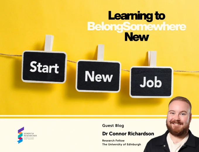A bright yellow background with three small black chalkboard signs hanging from a string by wooden pegs, spelling out Start, New, Job. The title Learning to Belong Somewhere New sits in the top right. A cream band runs along the bottom, showing the Dementia Researcher logo on the left, the name Dr Connor Richardson, Research Fellow at The University of Edinburgh, and a headshot of Connor on the right, a smiling man with short hair and a beard wearing a dark jacket.