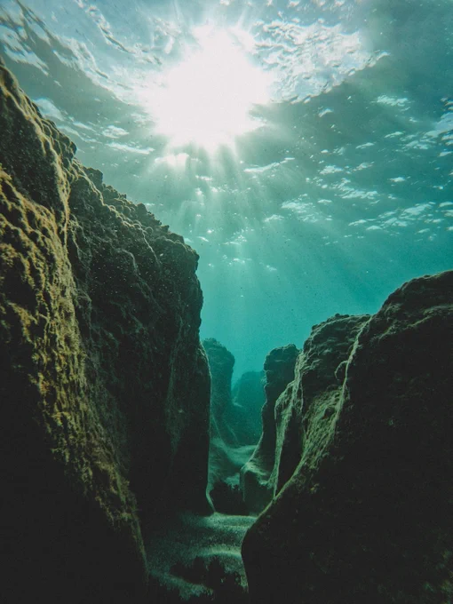 Photo by Daniel Newman on Unsplash:

https://unsplash.com/photos/the-sun-shines-through-the-water-over-rocks-loI3tzViw-E