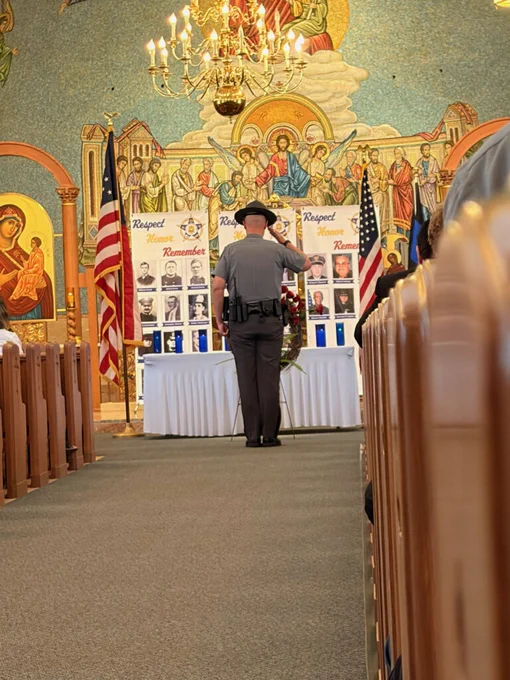 Sgt. Abbey salutes in memory of the fallen officers.