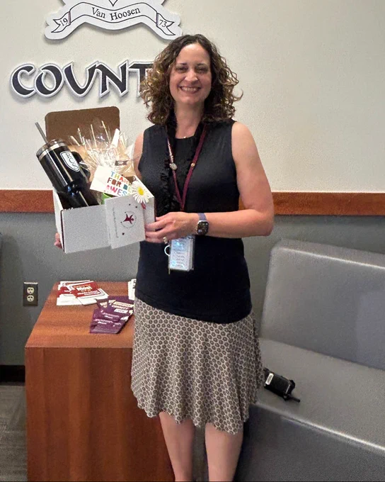 Teacher with thank you gift. 