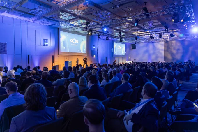 Attendees gathered in the main conference hall during the opening session of the Nextcloud Summit 2026 in Munich. The large auditorium is filled with participants listening to keynote presentations on digital sovereignty and open source technologies.