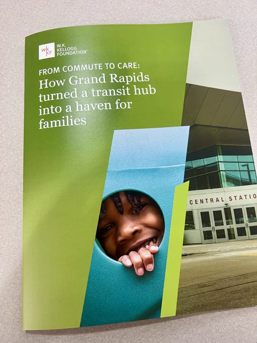 Cover of a publication by the W.K. Kellogg Foundation titled "From Commute to Care: How Grand Rapids turned a transit hub into a haven for families." It features an image of a smiling individual peering through a hole in a turquoise structure, with Grand Rapids Central Station in the background.
