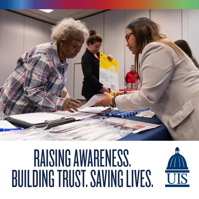 An elderly woman in a plaid shirt interacts with a seated representative at an informational booth during a community event.

Raising awareness. Building trust. Saving lives. 

The University of Illinois Springfield logo.