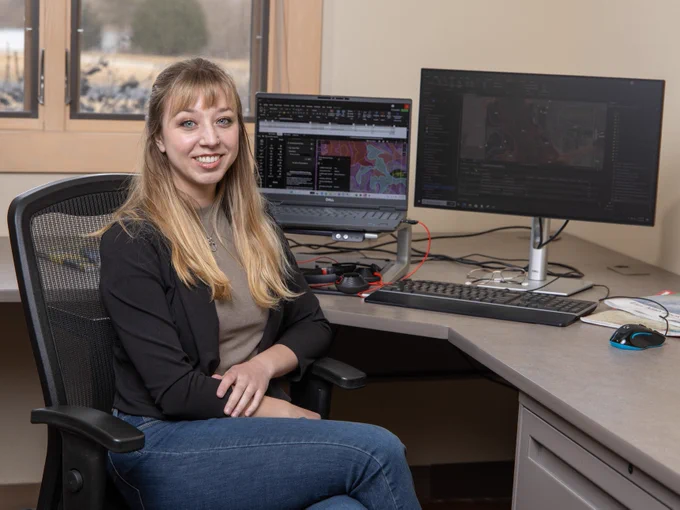 Student sitting at computer with GIS program