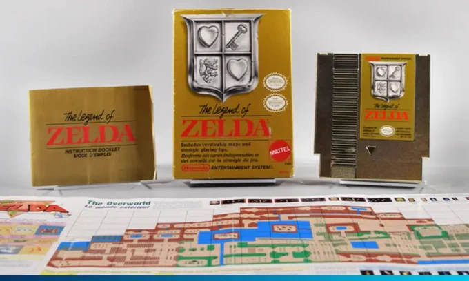 The image shows a collection of items related to "The Legend of Zelda" game by Nintendo. In the center, there's a game box featuring a shield emblem and the title. To the left, an instruction booklet is displayed. On the right is the game cartridge. A colorful map with detailed areas is spread out in front of these items.