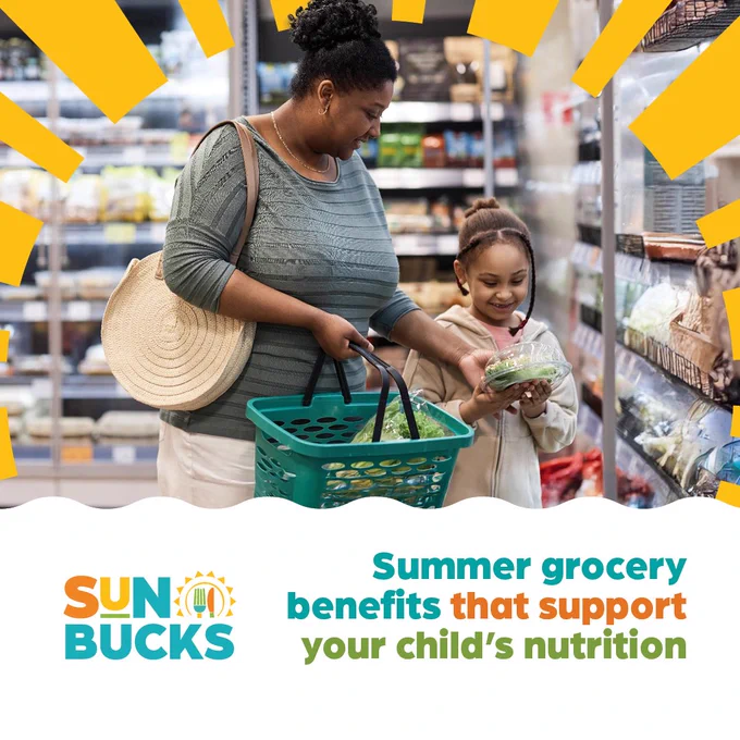 Mother and child shopping for fresh produce in a grocery store, focusing on nutritious summer foods.