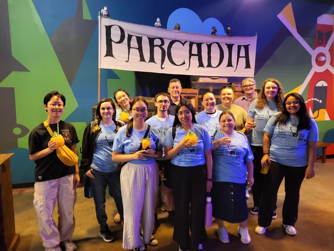 iSchool students smile for a group photo at Parcada, Urbana’s mini-golf tavern. 