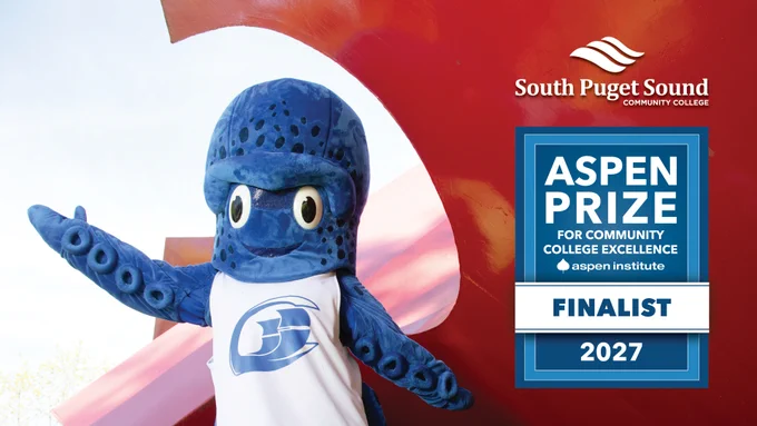 Percy the Kraken in front of a sculpture next to a badge that reads "Aspen Prize for Community College Excellence Aspen Institute Finalist 2027"