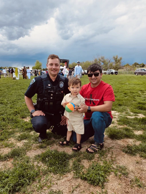 Officer smiling with festival attendees