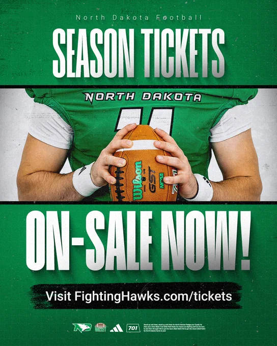 The image is an advertisement for North Dakota Football season tickets featuring a person in a green football uniform holding a Wilson football. Text reads: "Season Tickets On-Sale Now! Visit FightingHawks.com/tickets." Logos at the bottom include North Dakota Fighting Hawks, MVFC, and Adidas.