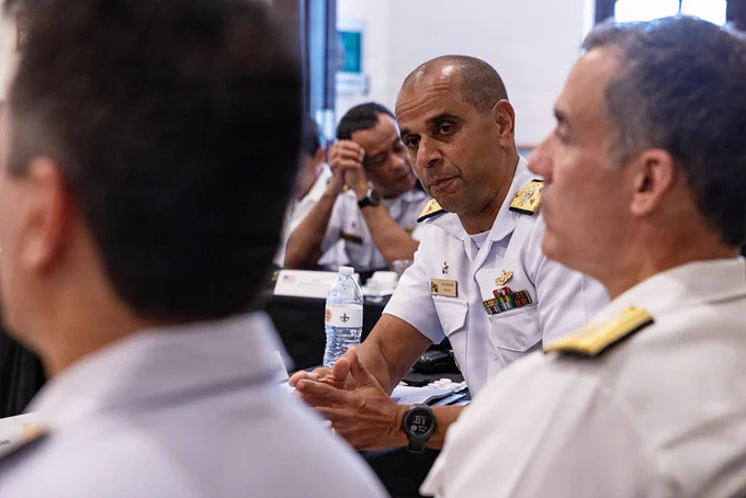 A Brazilian naval officer listens during a bilateral maritime engagement with U.S. and partner nation military leaders.