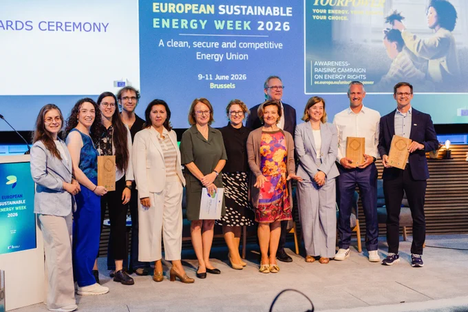 Winners stand on a stage during the European Sustainable Energy Week 2026 awards ceremony.