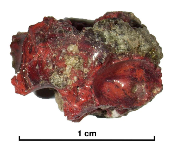 Incident light image of the red trinitite sample used in the study.