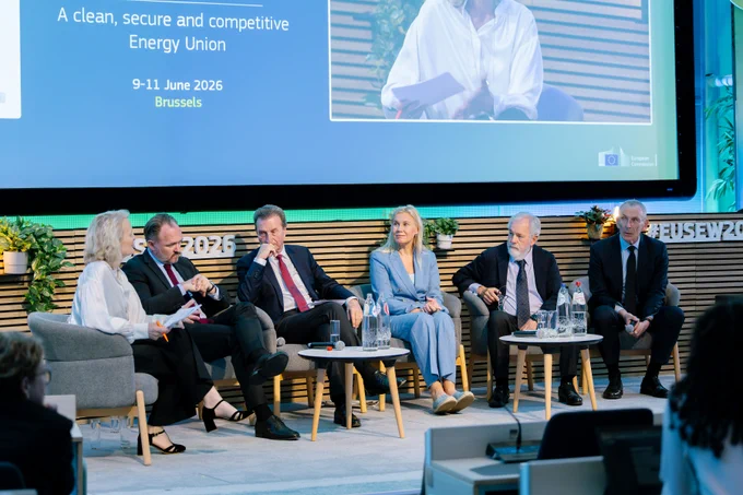 Current Commissioner Dan Jørgensen sits on stage with former Commissioners anda moderator during a fireside chat marking the 20th anniversary of EUSEW.