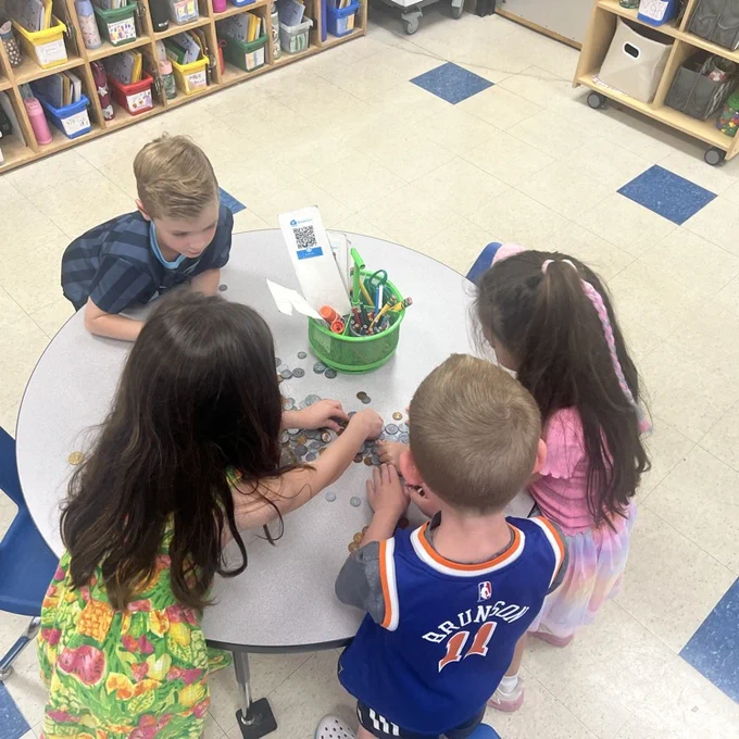 KRO sorts quarters, dimes, nickels and pennies in math