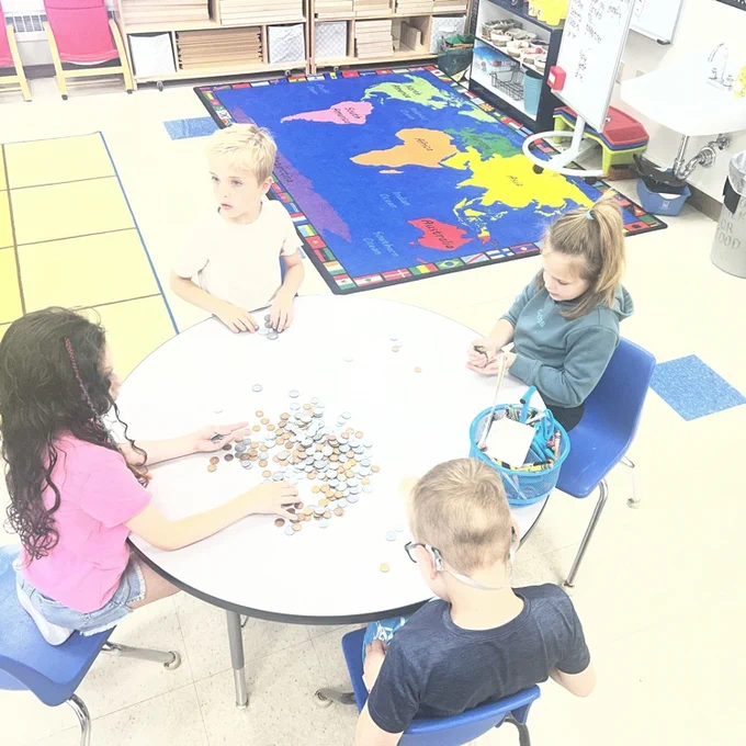 KRO sorts quarters, dimes, nickels and pennies in math