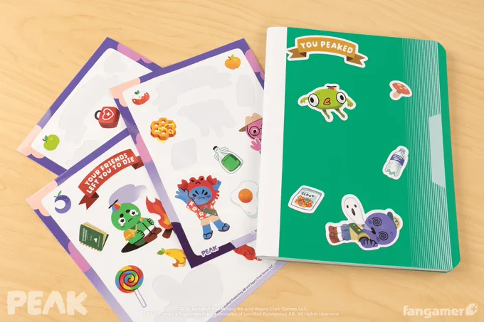 A photo of a partially used set of PEAK sticker sheets, with "You Peaked," Bing Bong, and other stickers on the front of a green notebook. 