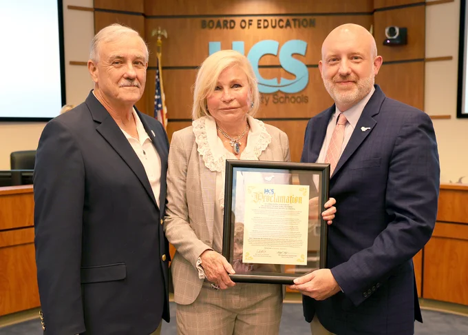 Photograph of HCS Board Chair David Cox, HGTC President, Dr. Marilyn Fore, and HCS Superintendent Clifford Jones