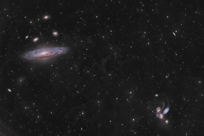 Sun took a photo of this expansive scene, pairing interacting galaxies of Stephan’s Quintet (bottom right) and NGC 7331 with the fleeting glow of a newly detected supernova, SN 2025 (top left).