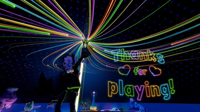 An attendee stands back to the camera, pointing their Pawblade asset up at the end of the fireworks show. The words Thanks for Playing! are lit up beside them.