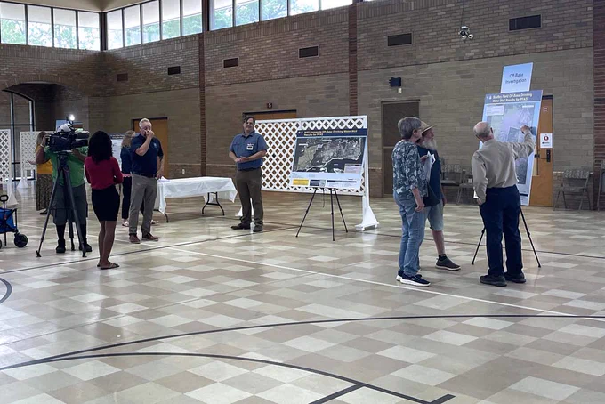 Navy and news crew at the public outreach event held to strengthen community involvement for PFAS related activities at the base. 