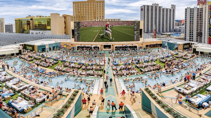This is where National Fantasy Football Draft Day happens. Stadium Swim at Circa Las Vegas. 4,000 fans. 24 pools. A 143-foot screen. August 21st.