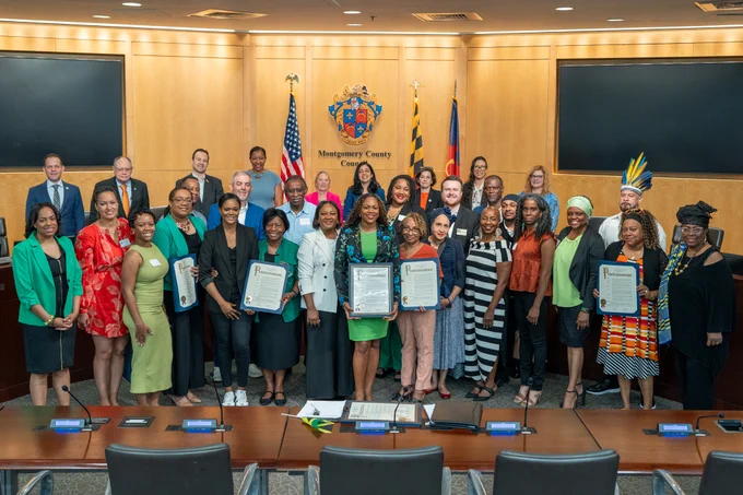 Councilmembers and members of the Caribbean American community in the Montgomery County Council Hearing Room.