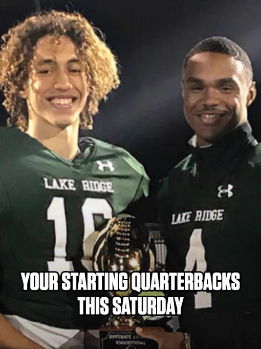 Two high school quarterbacks from Lake Ridge smiling with a trophy. The image exudes a cheerful and victorious mood with bright stadium lights in the background.