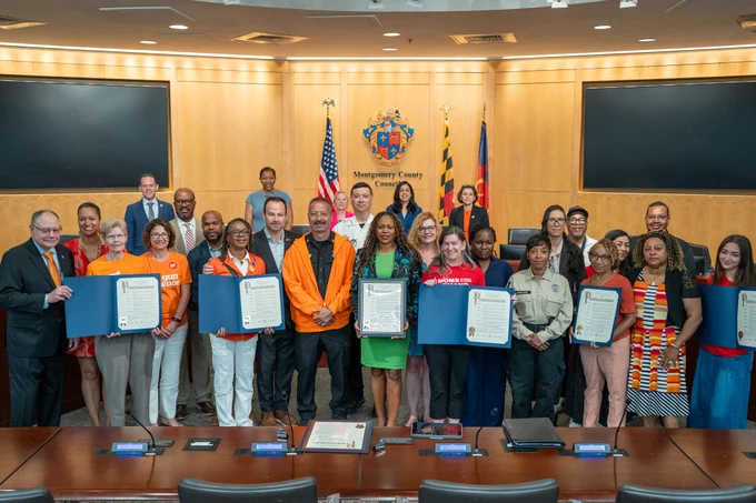 Councilmembers, activists and local leaders in the Montgomery County Council Hearing Room.