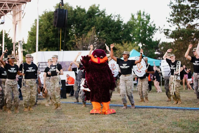 Hokie bird dances with the Corps of Cadets at an event.
