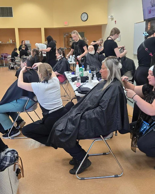 Cosmetology students cut and style hair for several community members.