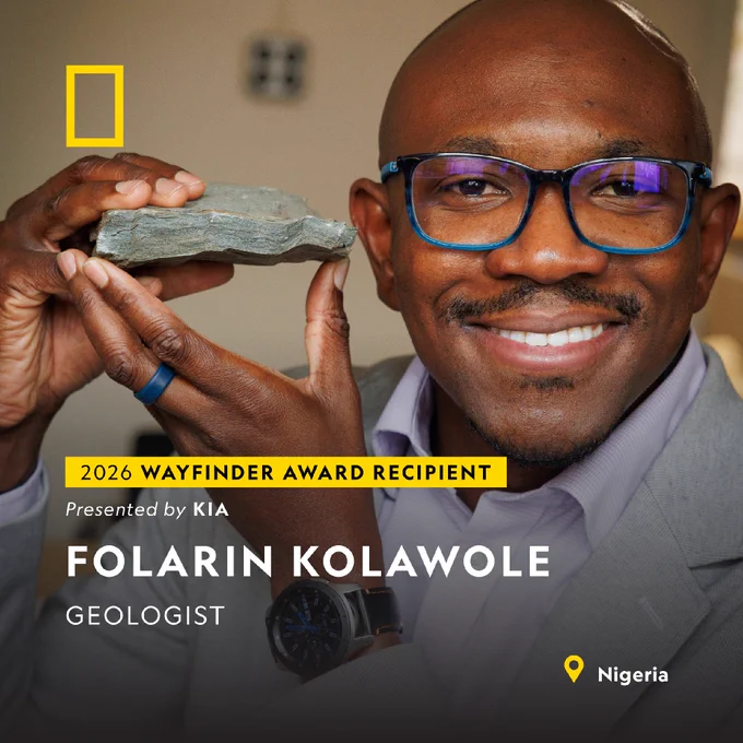 Geologist Folarin Kolawole holding a rock with text 2026 Wayfinder Award Recipient.
