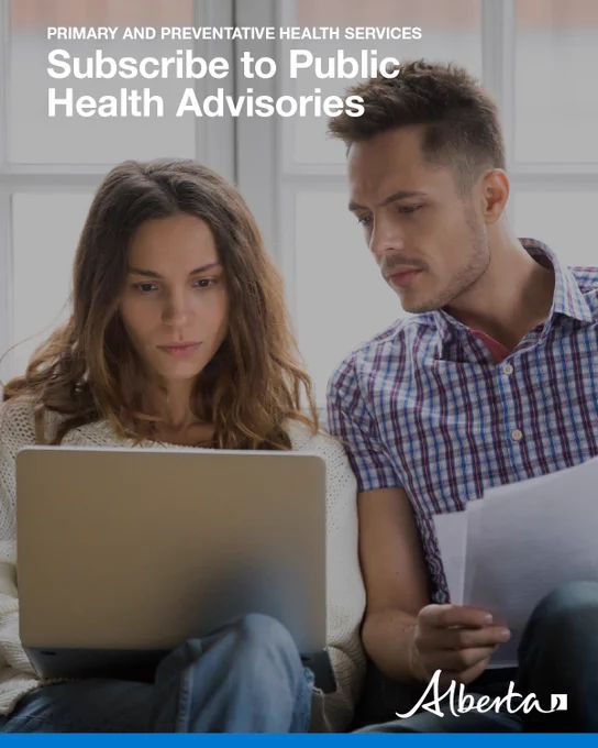 Two people sit on couch looking at laptop. Text reads: Primary and Preventative Health Services. Subscribe to Public Health Advisories. Alberta logo in bottom right corner. 