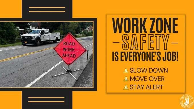 A photo of a road work ahead sign on a roadway is displayed beside the message “Work Zone Safety is Everyone’s Job!” The graphic reminds drivers to slow down, move over, and stay alert. The Erie County Highway Division logo appears in the corner.