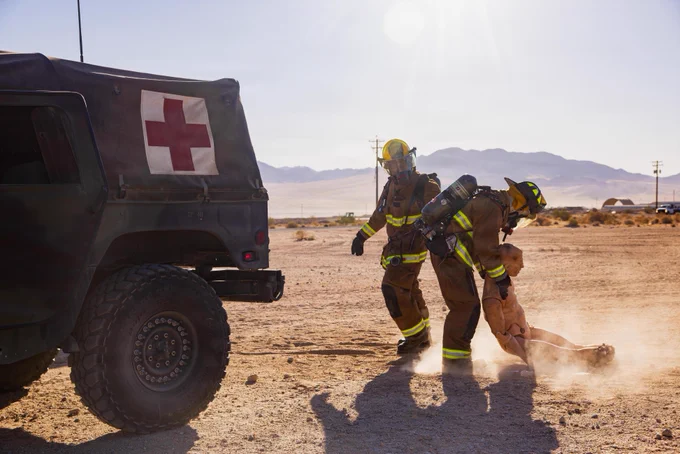 U.S. Marines assigned to Marine Wing Support Squadron 473, Marine Aircraft Group 41, 4th Marine Aircraft Wing, take a simulated casualty to a casualty collection point at an aircraft rescue and firefighting event during Integrated Training Exercise 3-26 on Marine Corps Air Ground Combat Center Twentynine Palms, California, June 5, 2026. ITX is designed to generate combat readiness and ensure the Reserve Component provides critical strategic depth to the Total Force. From complex combined arms maneuvers to all-domain integration, these Marines are proving that they are ready to augment, reinforce, and fight alongside the active component at a moment's notice. (U.S. Marine Corps photo by Cpl. Van Hoang)\n\n