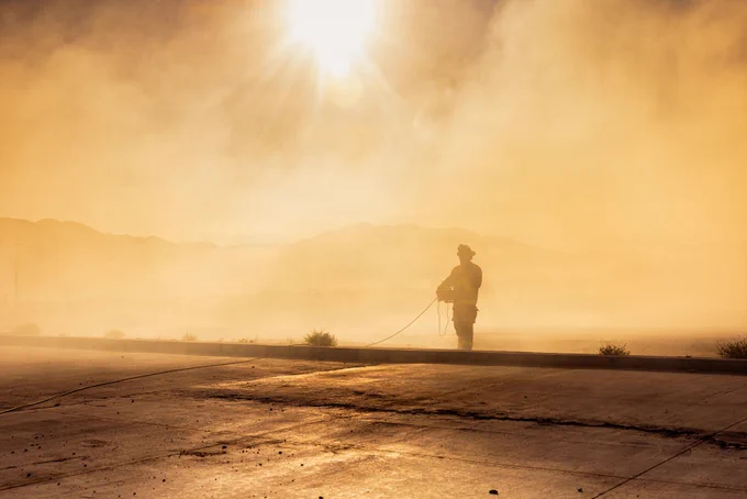 A U.S. Marine with Marine Wing Support Squadron 473, Marine Aircraft Group 41, 4th Marine Aircraft Wing, uses smoke grenades and a smoke machine to simulate an aircraft fire at an aircraft rescue and firefighting event during Integrated Training Exercise 3-26 on Marine Corps Air Ground Combat Center Twentynine Palms, California, June 5, 2026. ITX is designed to generate combat readiness and ensure the Reserve Component provides critical strategic depth to the Total Force. From complex combined arms maneuvers to all-domain integration, these Marines are proving that they are ready to augment, reinforce, and fight alongside the active component at a moment's notice. (U.S. Marine Corps photo by Cpl. Van Hoang)\n\n