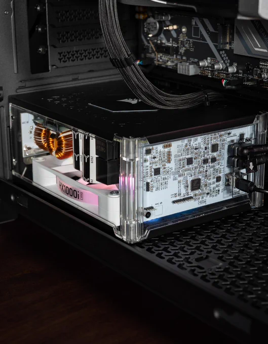 A close up view of the HX1000i SHIFT Crystal.  The background is dark, making the colors of the fans and interior much more intense in brightness and color. 