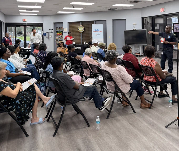 Community members attend a fire safety presentation in the City of North Miami as a Miami-Dade Fire Rescue Community Affairs team member provides home fire safety and smoke alarm education.