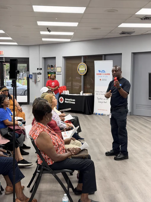 Community members attend a fire safety presentation in the City of North Miami as a Miami-Dade Fire Rescue Community Affairs team member provides home fire safety and smoke alarm education.