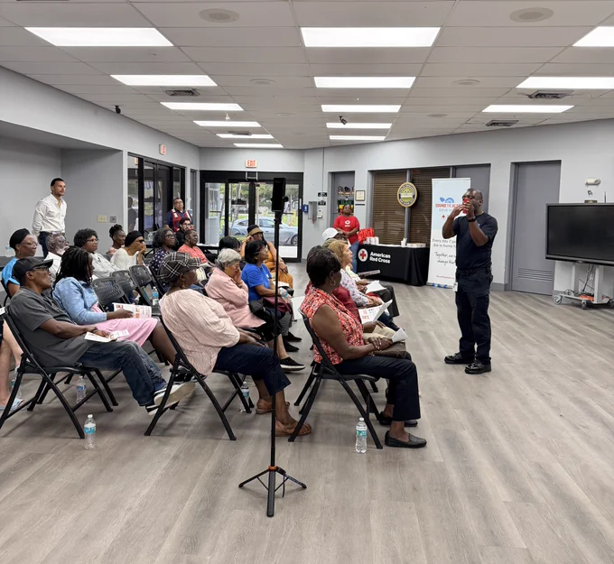 Community members attend a fire safety presentation in the City of North Miami as a Miami-Dade Fire Rescue Community Affairs team member provides home fire safety and smoke alarm education.