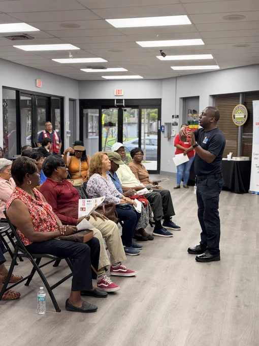 Community members attend a fire safety presentation in the City of North Miami as a Miami-Dade Fire Rescue Community Affairs team member provides home fire safety and smoke alarm education.